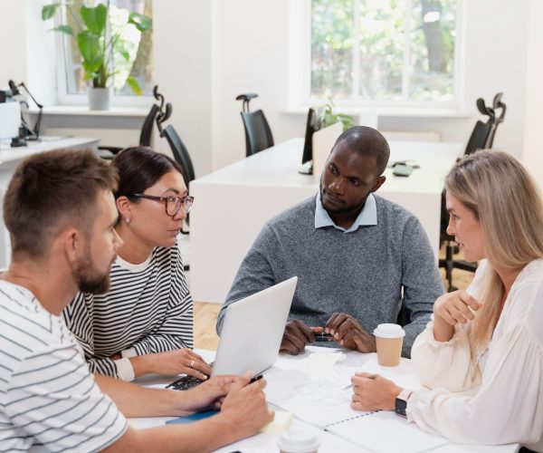 close-up-young-colleagues-having-meeting